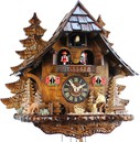 Horloge coucou m&eacute;canique 8 jours musical b&ucirc;cheron roue du moulin gros plan