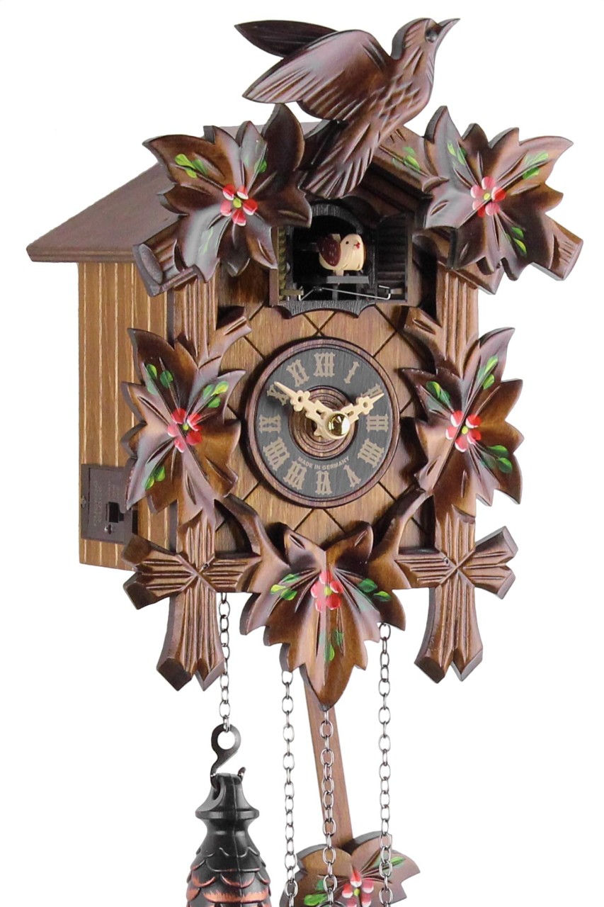 Horloge coucou musical fleurs rouges gros plan