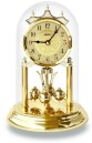 Pendule 400 jours en m&eacute;tal dor&eacute; 23 cm cadran dor&eacute; fleurs dor&eacute;es