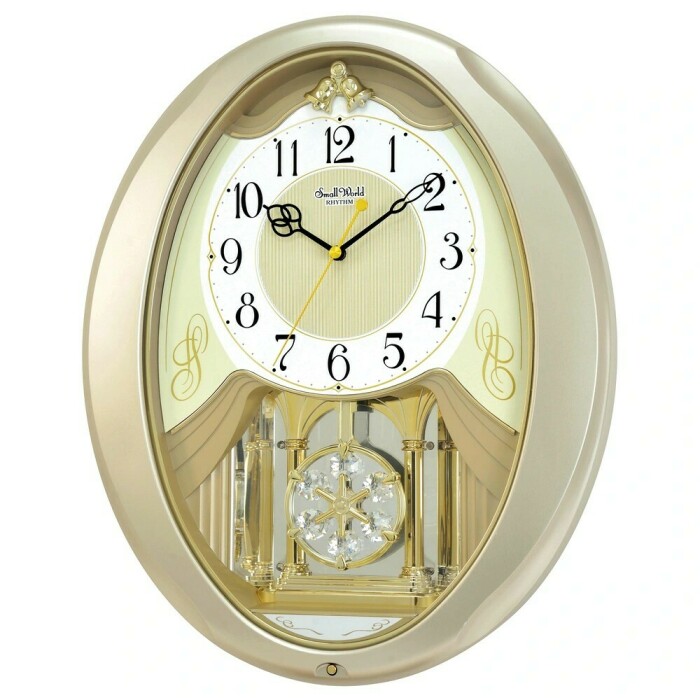 Horloge murale Small World ovale dorée musicale