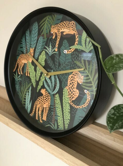 Pendule à quartz ronde cadran noir "Jungle"